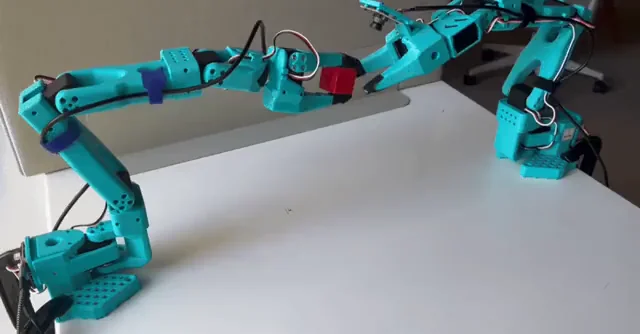 The SO-100 arm performing a pick task